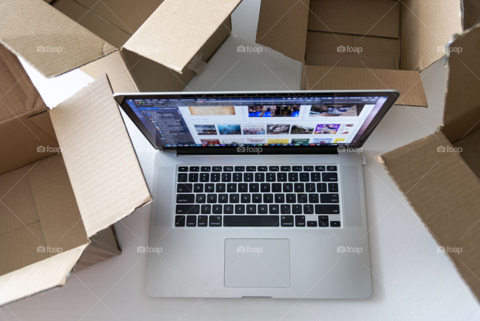 Computer with shipping boxes