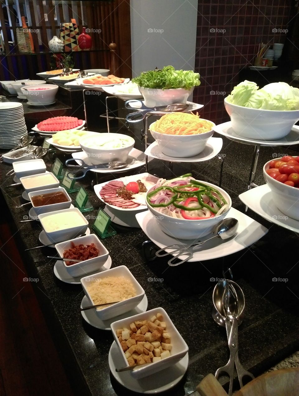 salad bar and fruits in hotel buffet