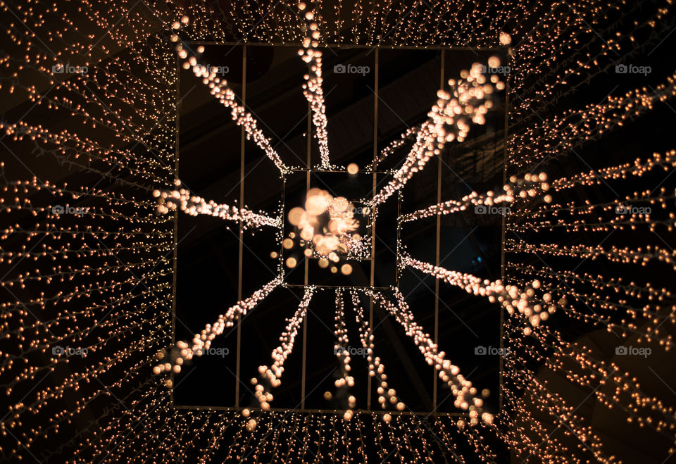 I was wandering in a shopping mall and found this wonderful golden chandelier in the middle of the atrium.