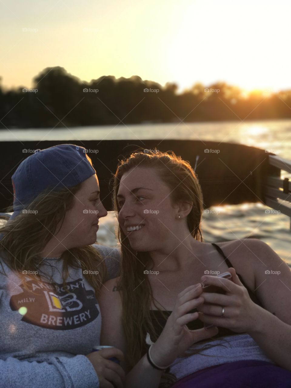 Couple enjoying the sunset on the lake