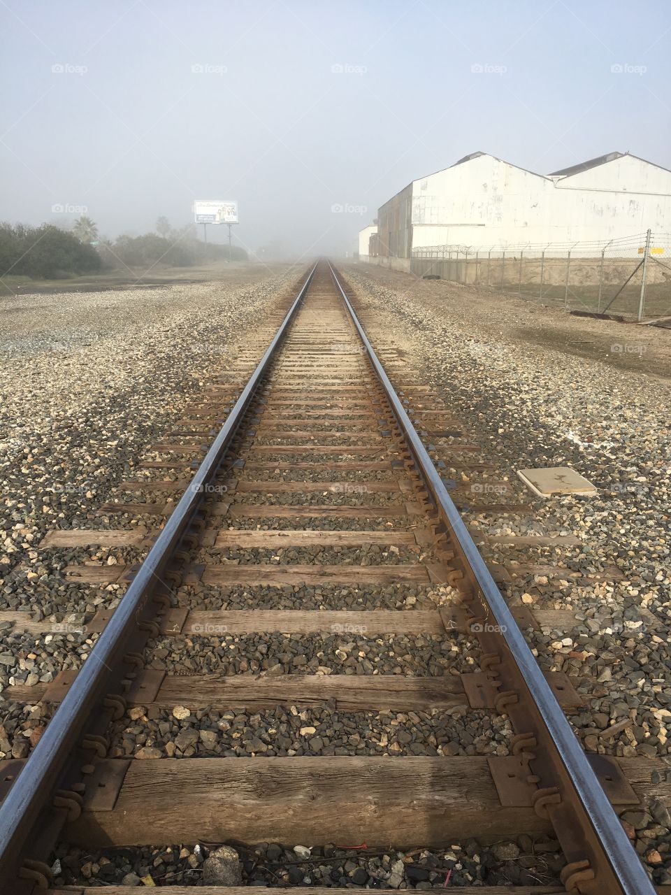 Empty rail track with fog