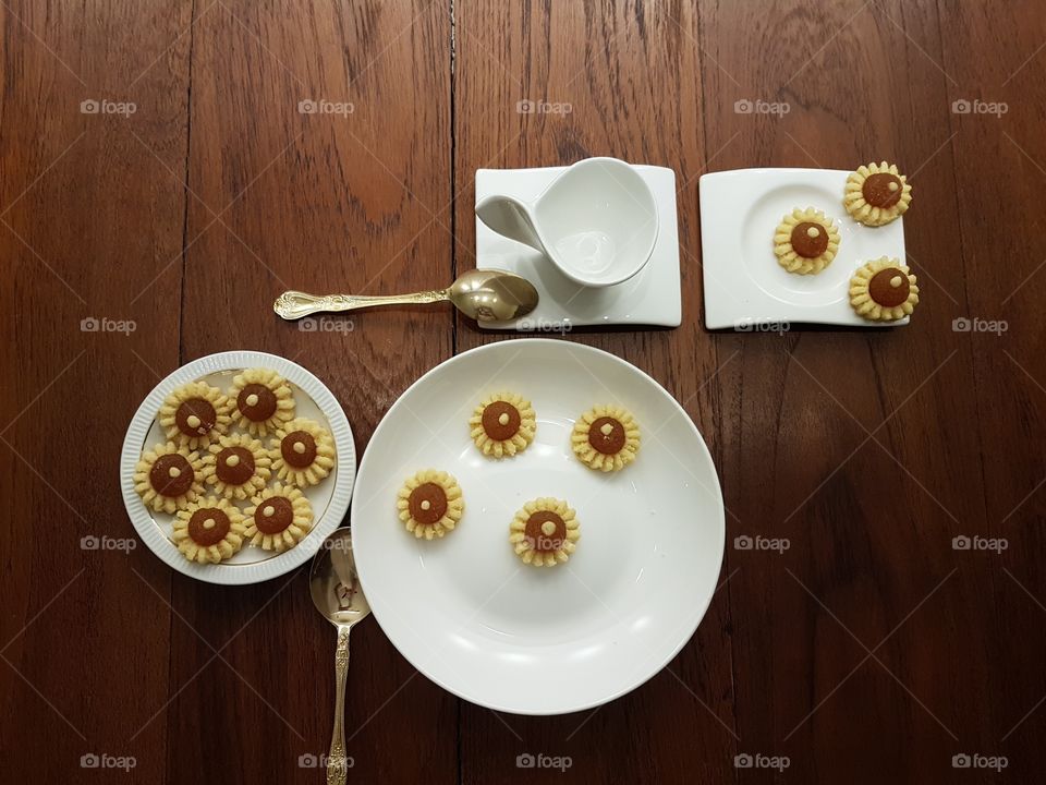 Preparing tea time with homemade delicious beautiful yellow  flower shaped pineapple tart pastry