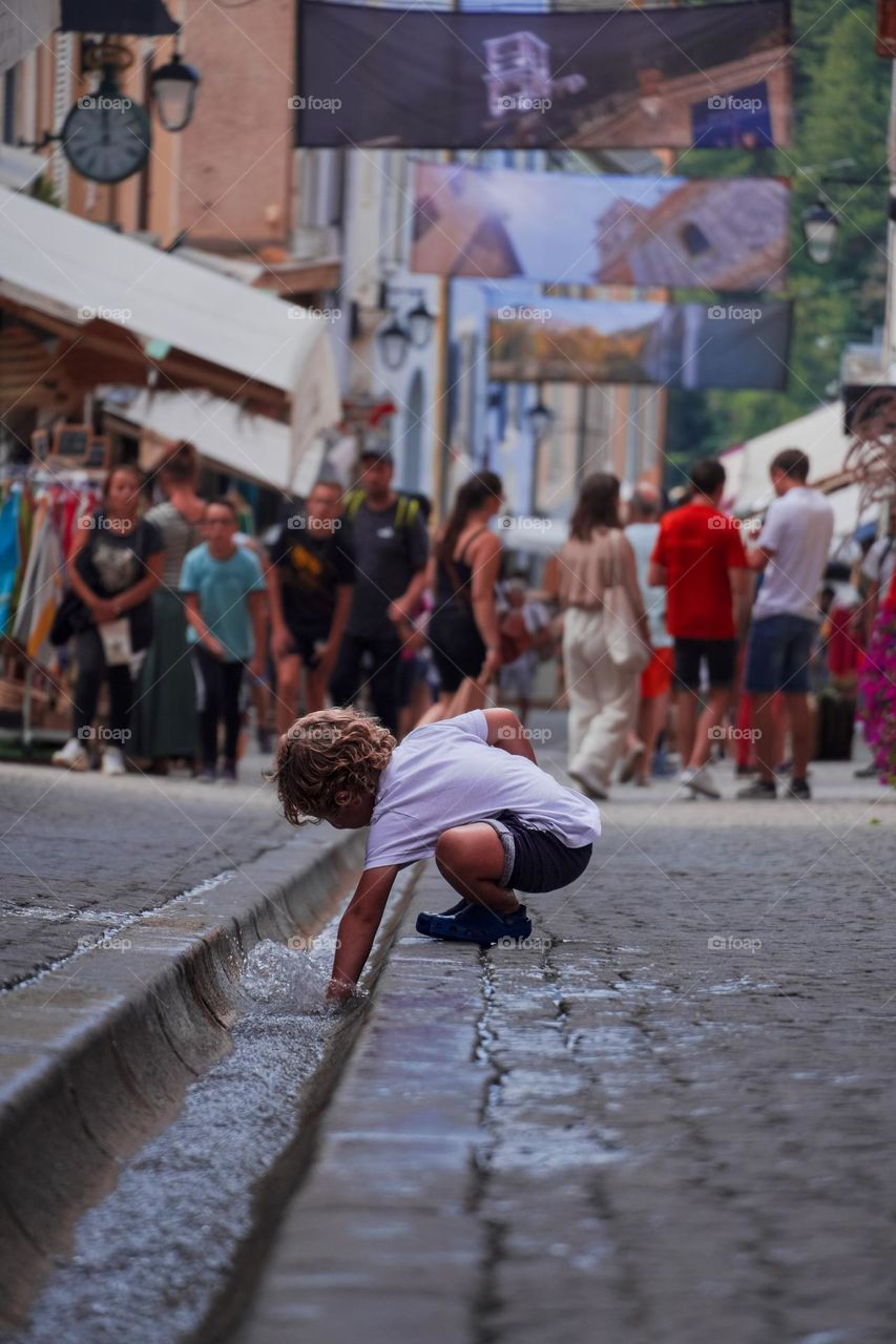 boy playing in the crowd 