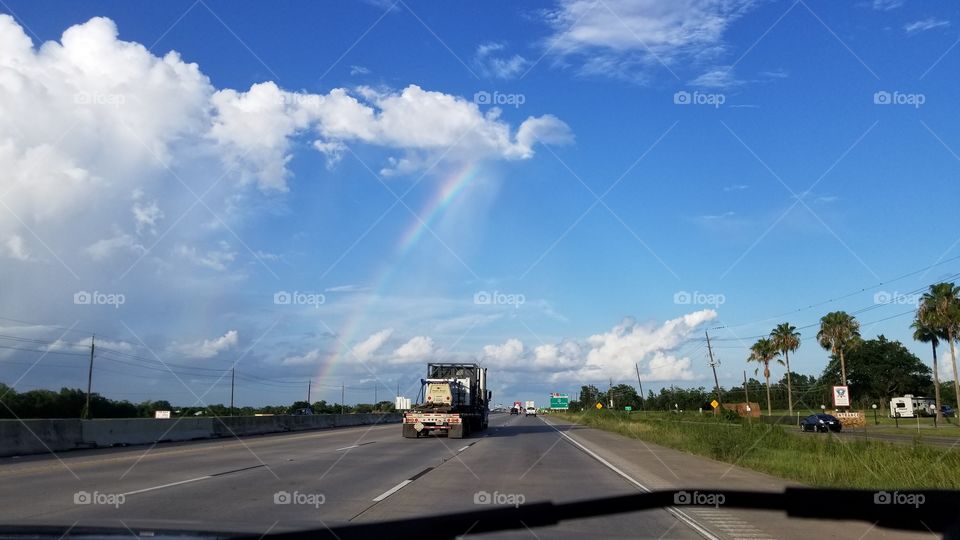 Rainbow above a highway in Texas.