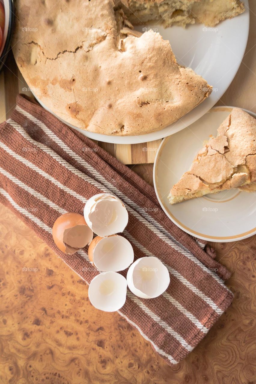 Making homemade puffed apple pie with eggs, sugar and flour.