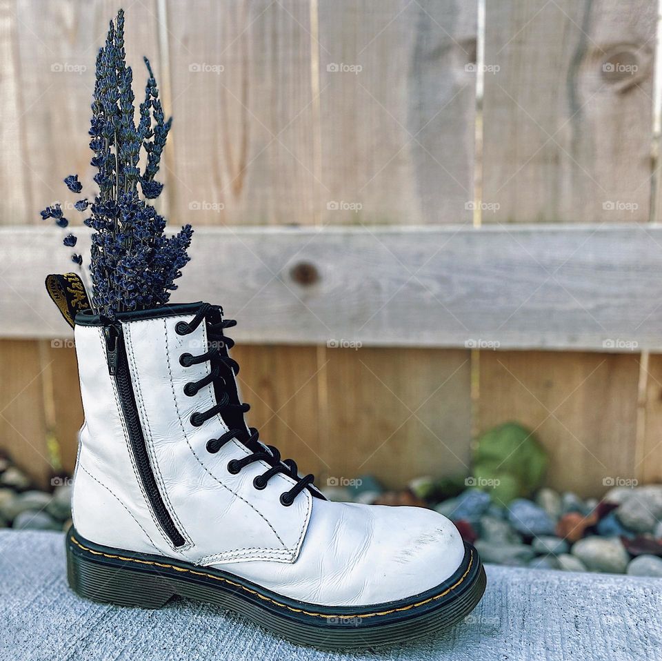 Doc Marten Boots with wildflowers, Dr. Marten boots used as a vase, boots and flowers, white Docs and purple lavender, white Dr. marten boots, fun and creative ways to display a bouquet 