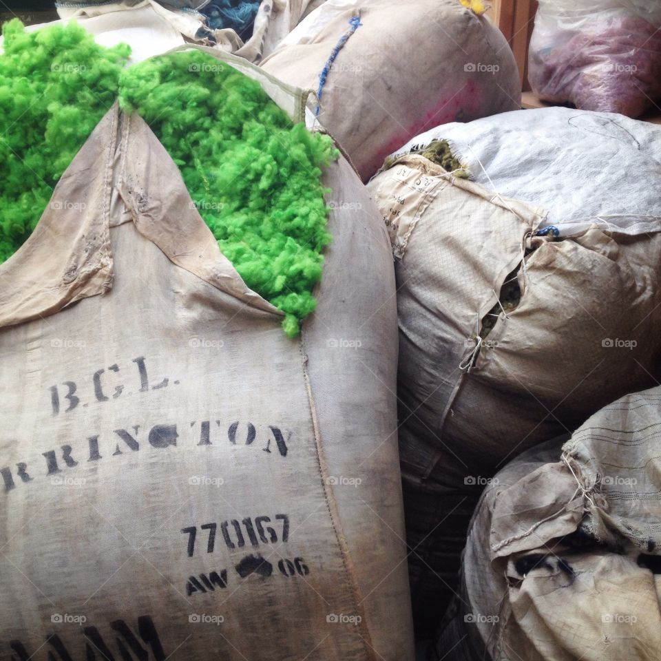 Bags of green wool