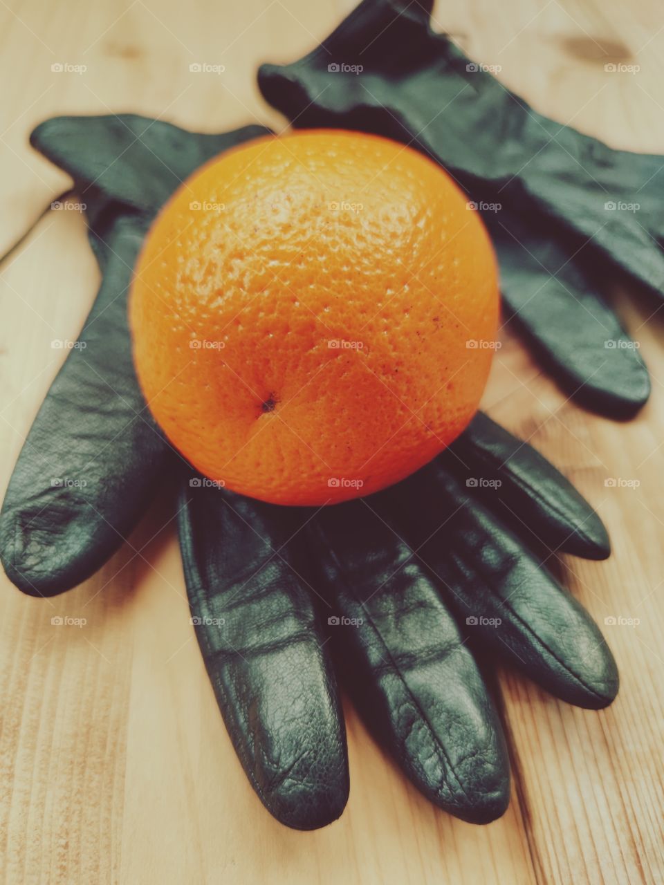 Orange on black gloves.  Preparing for winter