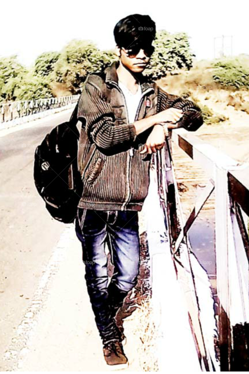 Photographs of a boy/photographs of a boy in good style/Photographs of model wearing jeans/Model of standing model in a beautiful style/ glasses with model/Photograph of Begged Legs Model/Great photo of male model/photograph of Indian bo