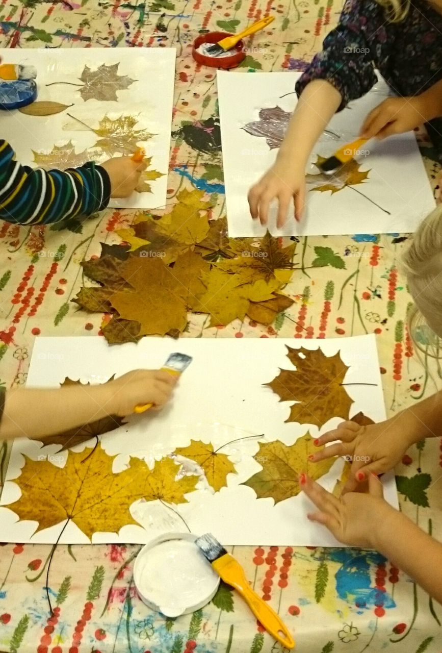 Beeing creative. Children Beeing creative with leaves