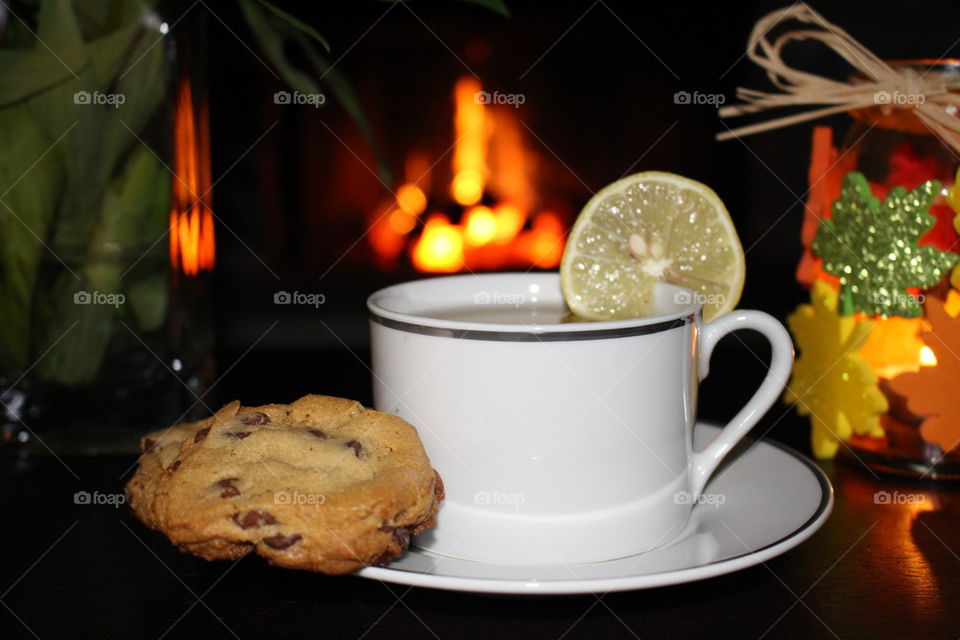 A cup of tea with cookie