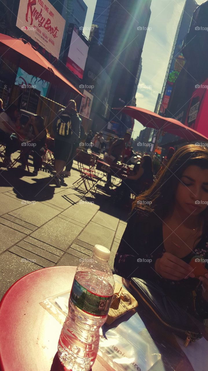 new York city times square enjoying a bite to eat