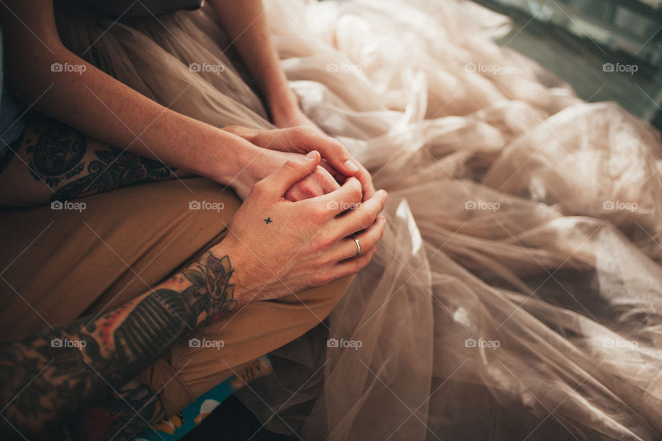 hands of lovers with tatto