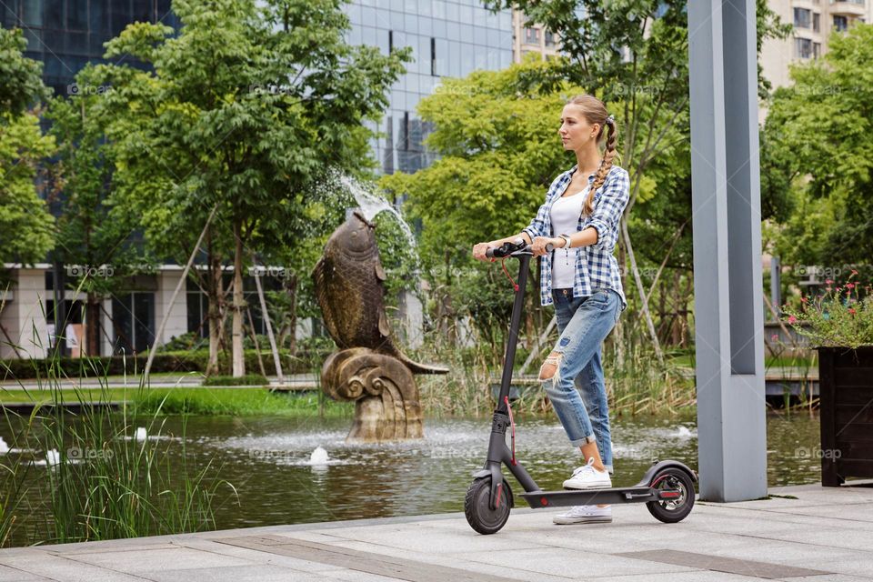 Woman riding on scooter 