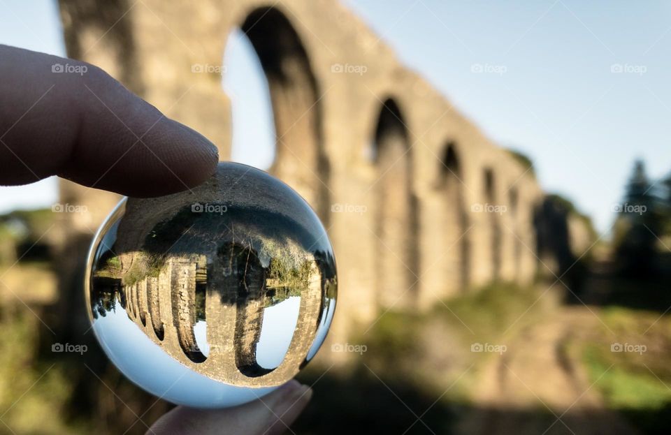 Acueducto de los Pegões reflected in a lens ball