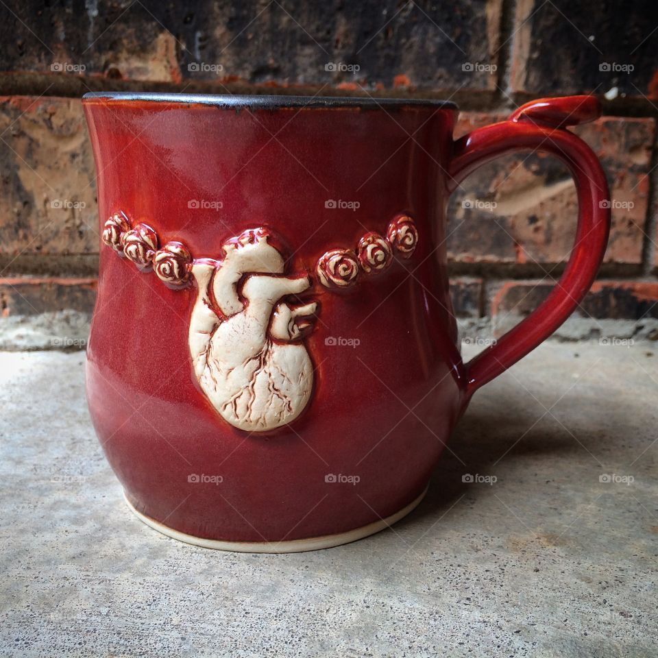 Have a heart. Handmade mug with anatomical heart and roses
