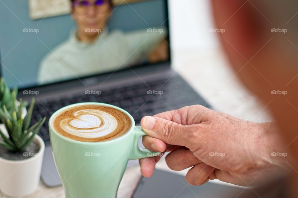 Man talking on his computer via facetime 