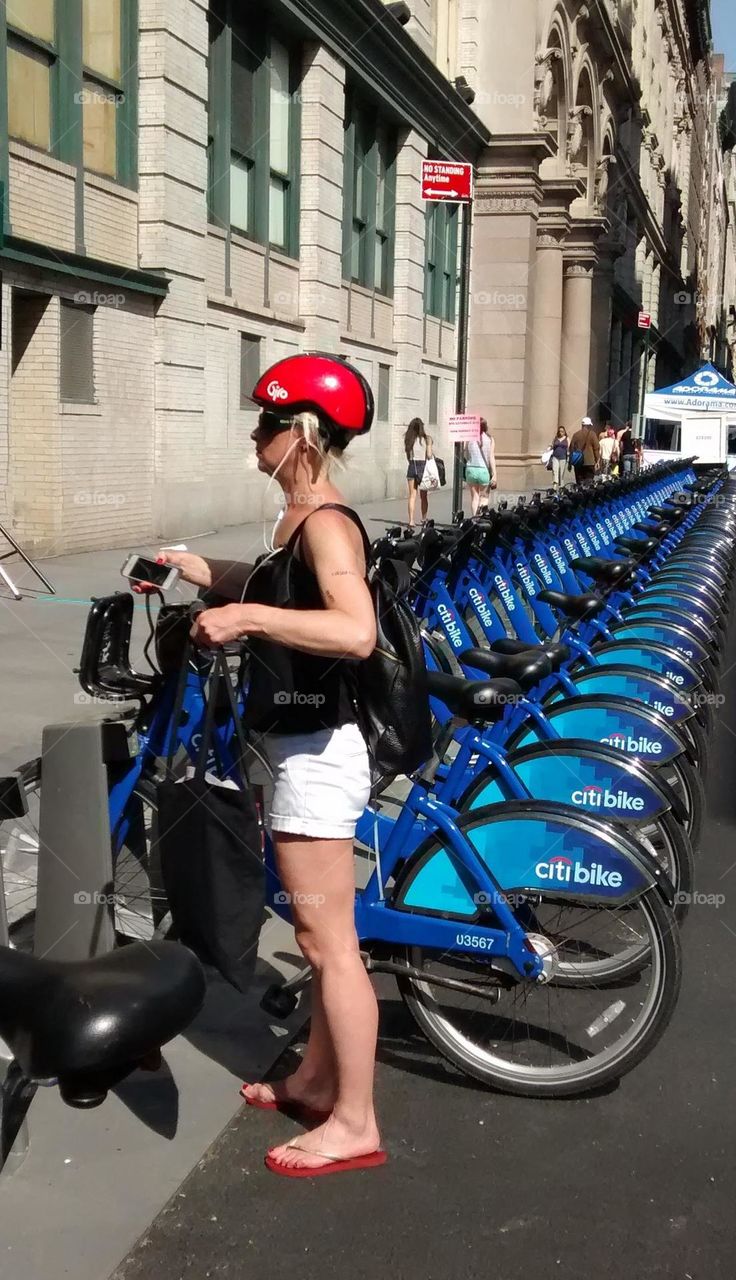 Many Citi Bikes Lined Up on Street NYC