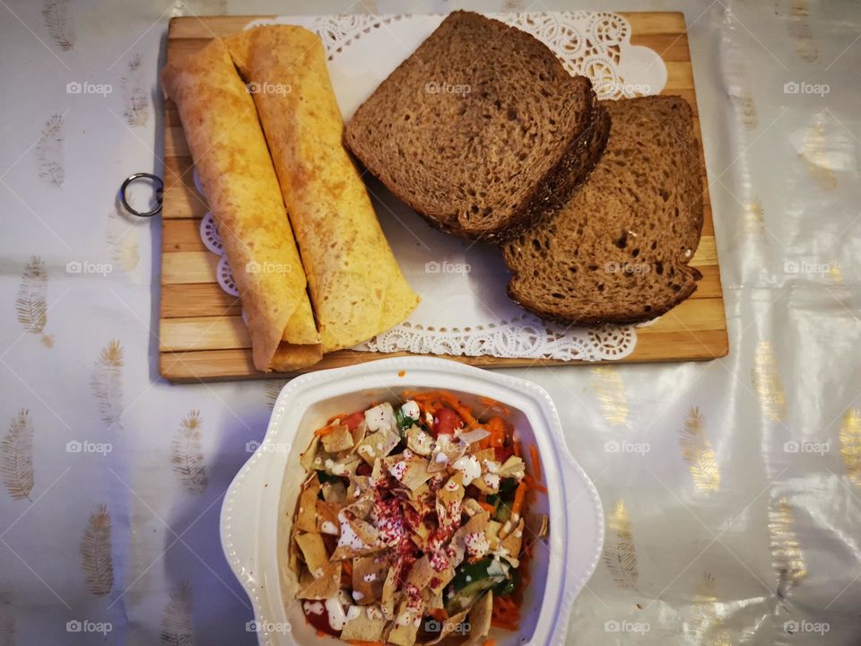 Morning meal of wild bread with tortilla bread and salad