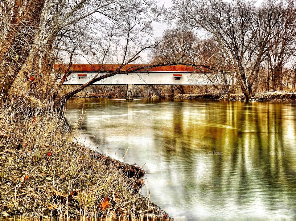 Covered bridge on a winter day in Indiana on the river 