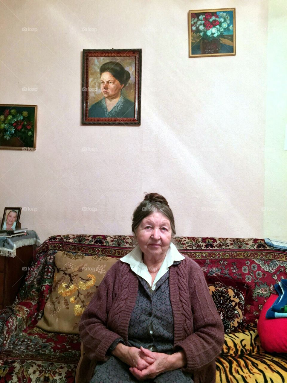 Granny in old style Soviet interior.