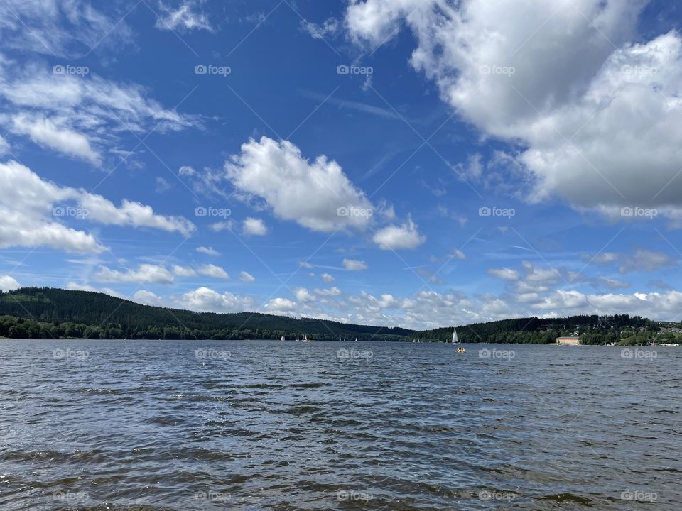 View of the Lipno reservoir with sailboats.