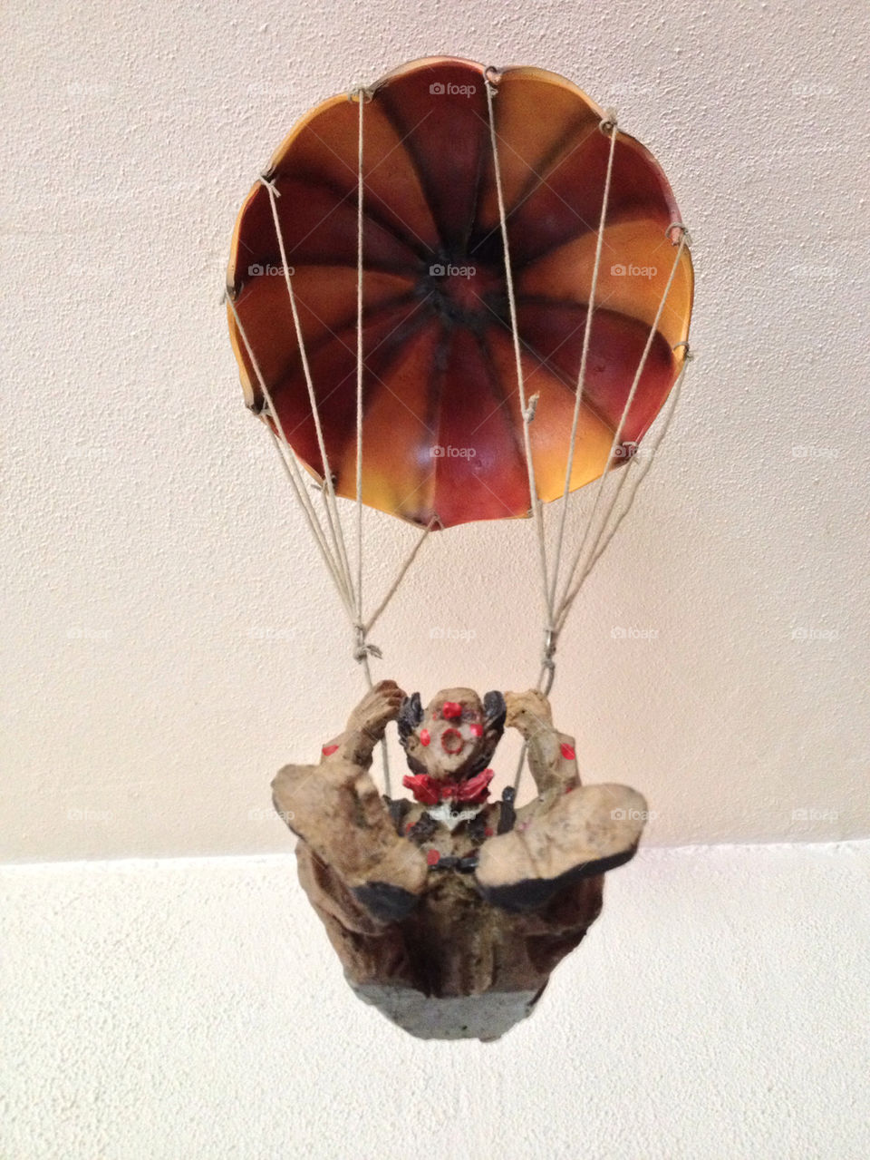 Clown with parachute.