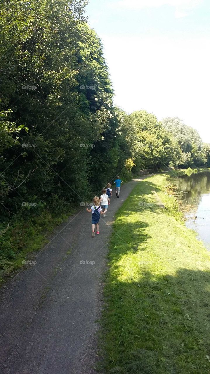 Family Walk By The Canal
