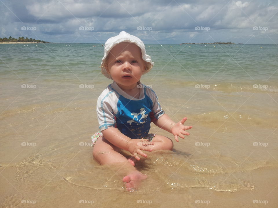 baby playing in The beach