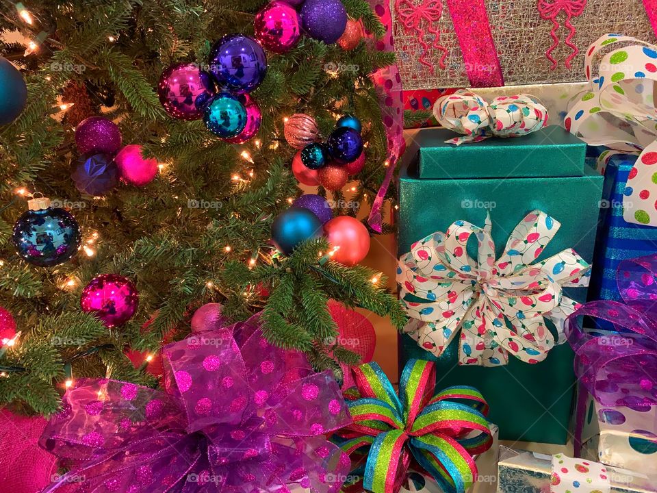 Beautifully wrapped Christmas gifts under the Christmas tree.