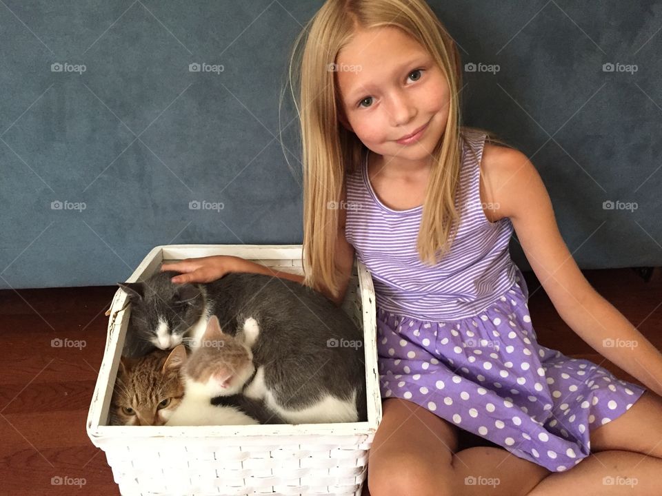 Little girl with her cats