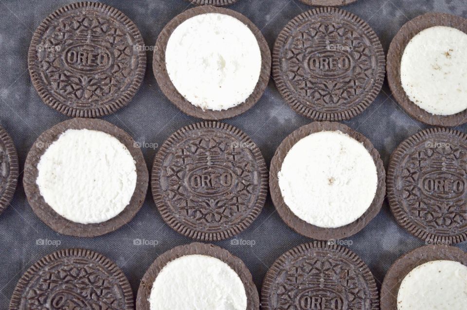 Contrasting Oreo cookies on a black background 