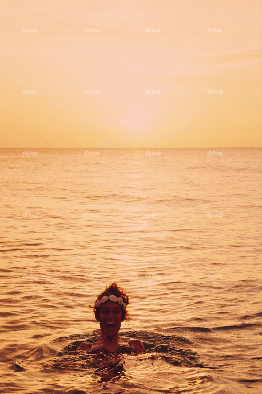 Young woman swimming in sea