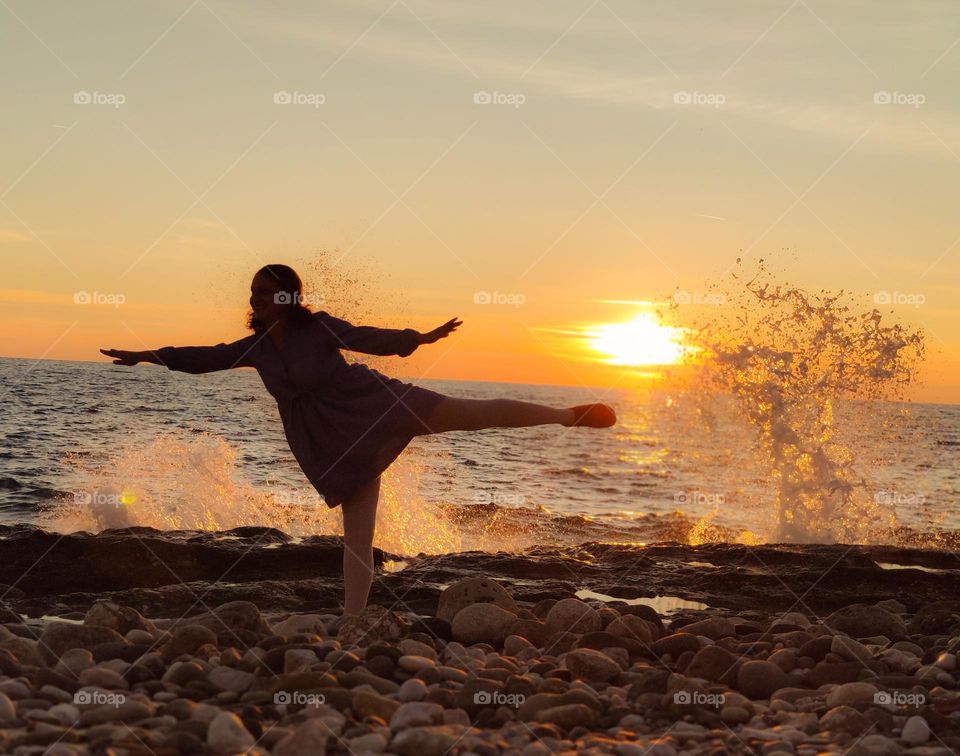 Beach yoga on sunset