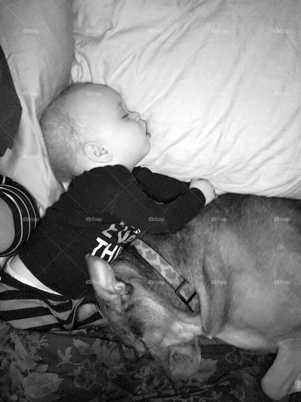 The snuggle is real. A boy and his dog, snuggled so close together in a deep sleep.