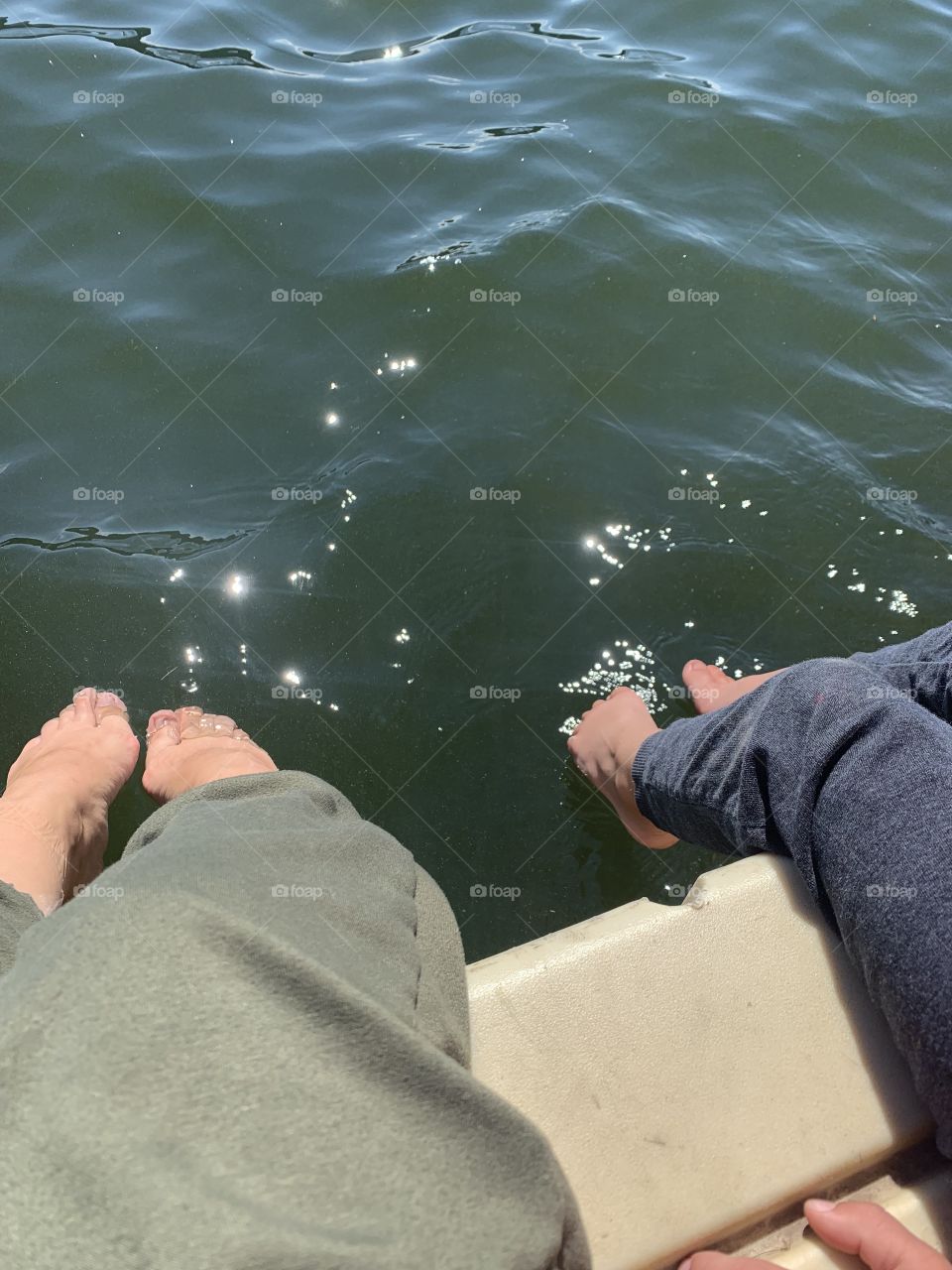Dangling feet in the water 