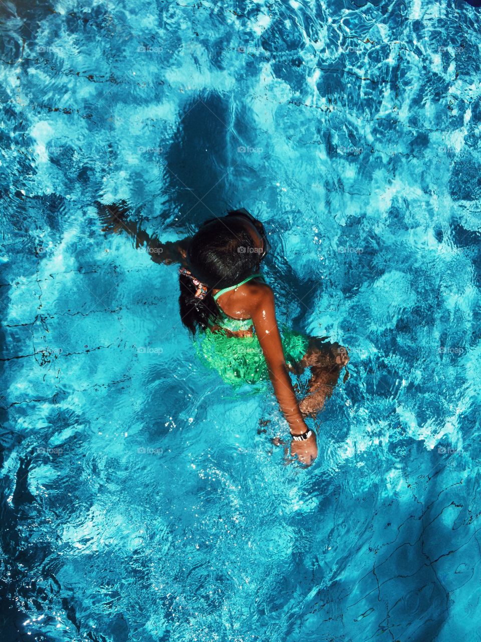 Teenage girl in swimming pool