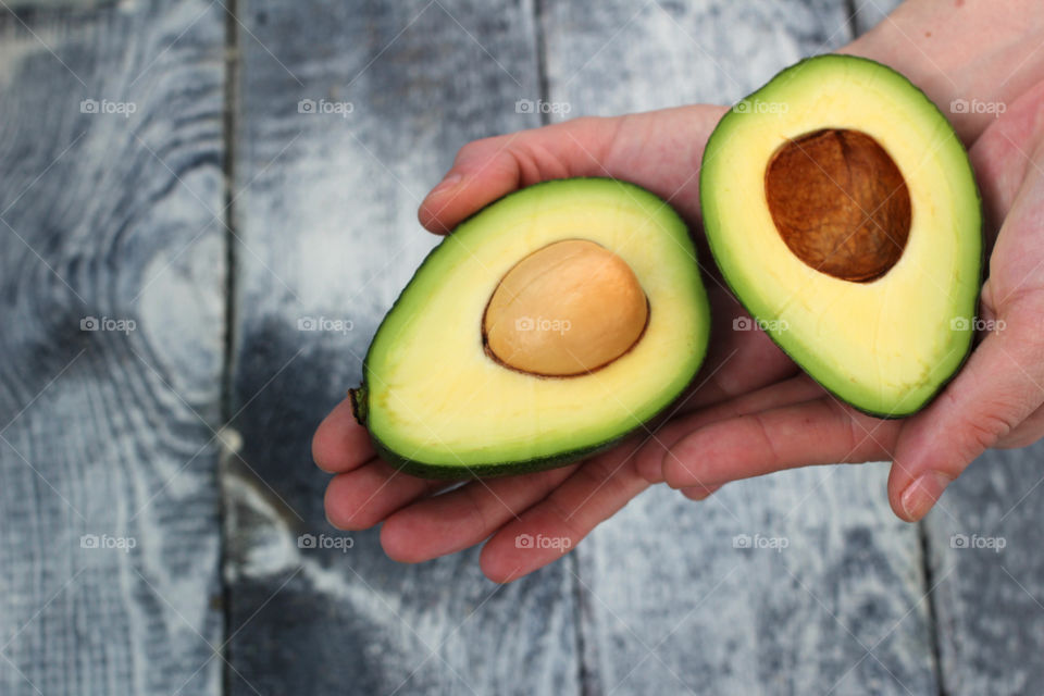 Hands, female hands, avocado in hands, avocado, fruit, food, abstraction, still life