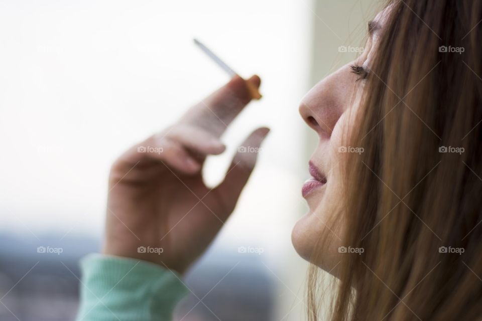 beautiful woman smoking cigarette