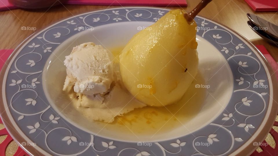 Poached Pear With Citrus Orange Zest Spiced Syrup Sauce and A Scoop Of Vanilla Ice Cream - Home Cooking Dinner Party Fruit Dessert