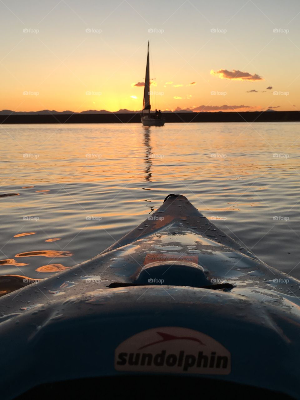 Kayaking at Sunset with sunset reflections 