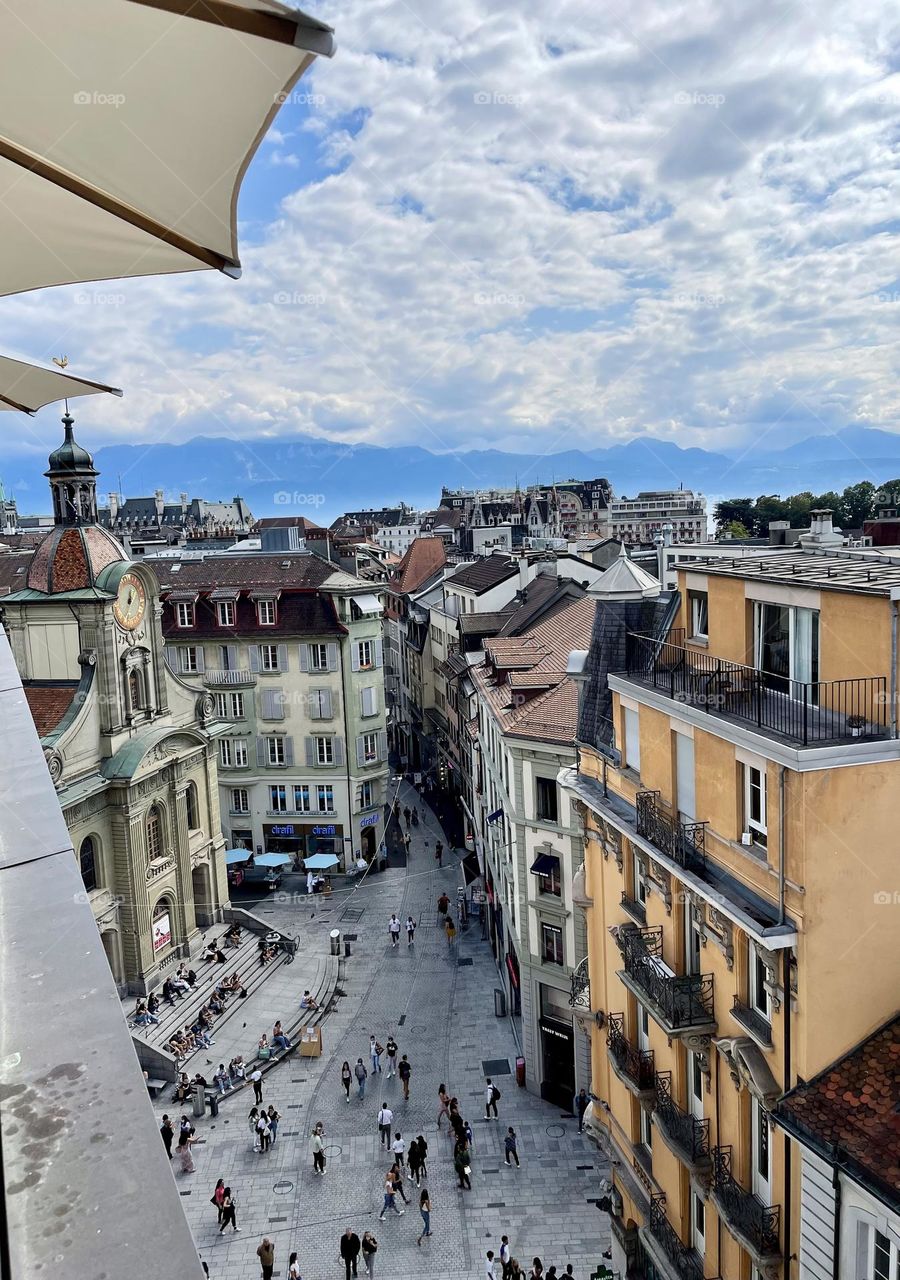 Aerial view of Lausanne city center, Switzerland, buildings and houses, blue cloudy sky