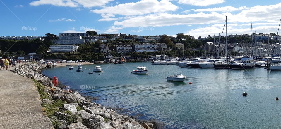 The sun shining down on brixham harbour