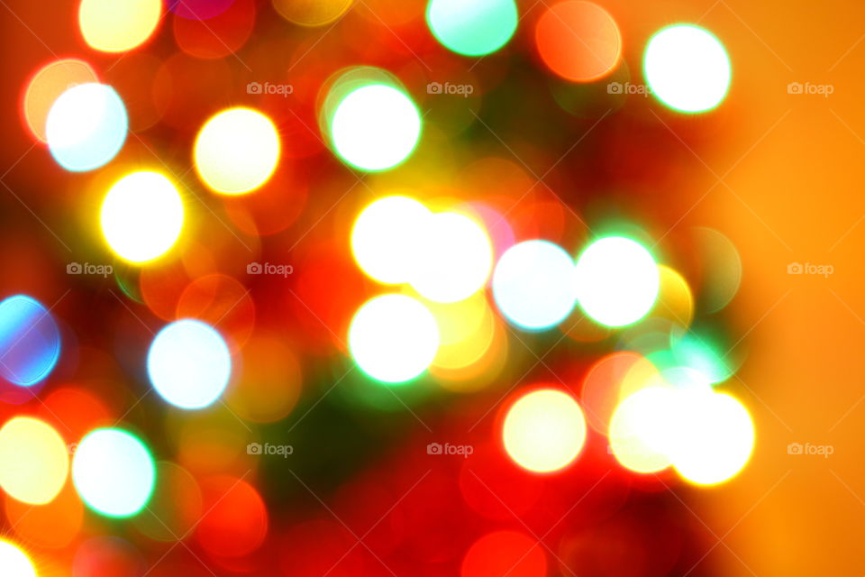 Macro shot of Christmas tree decorations and vivid lights