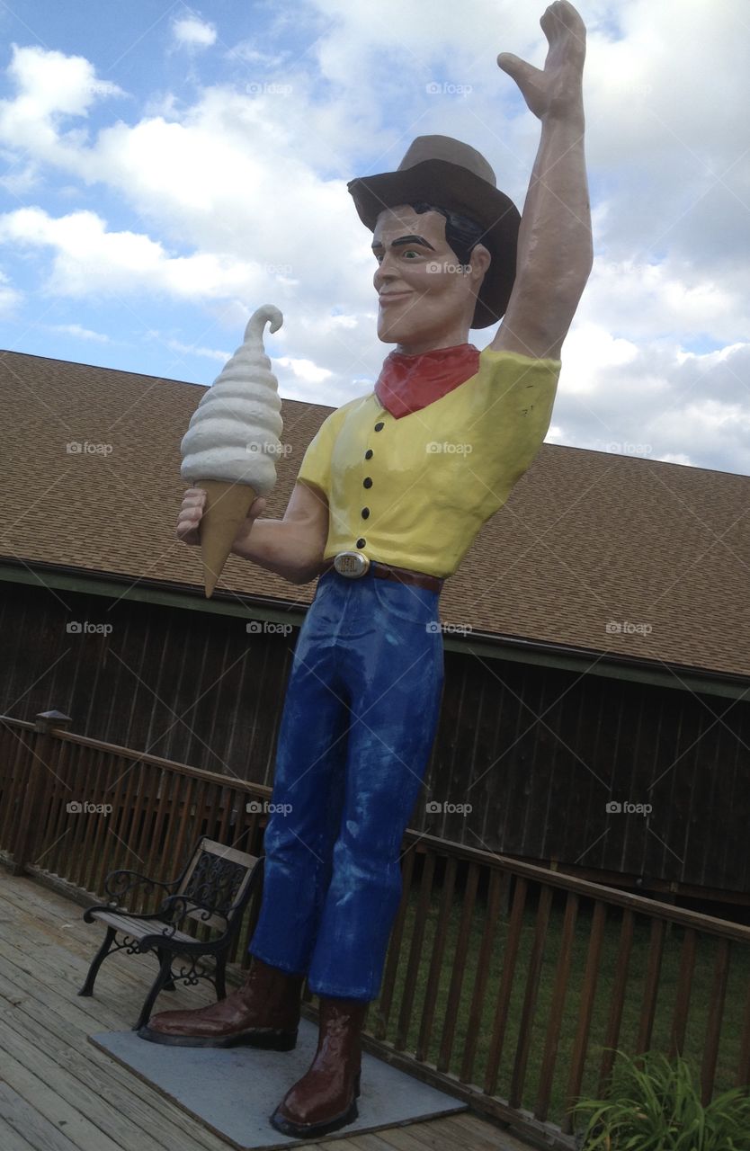 Giant Cowboy with Ice Cream Cone Statue