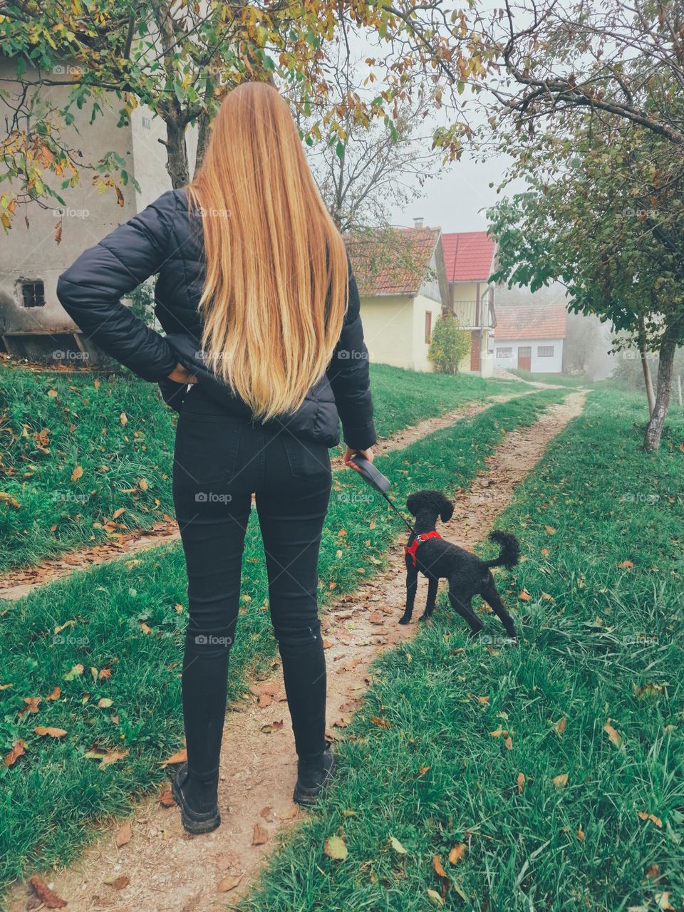 the blonde girl was walking the dog