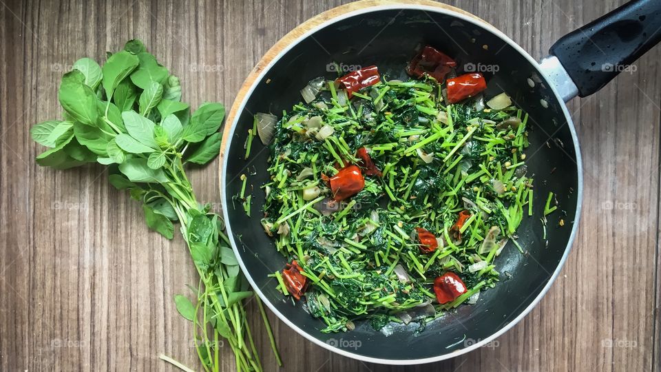 Green leaves getting cooked