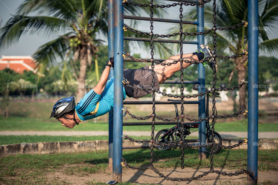 Man workout in the playground 