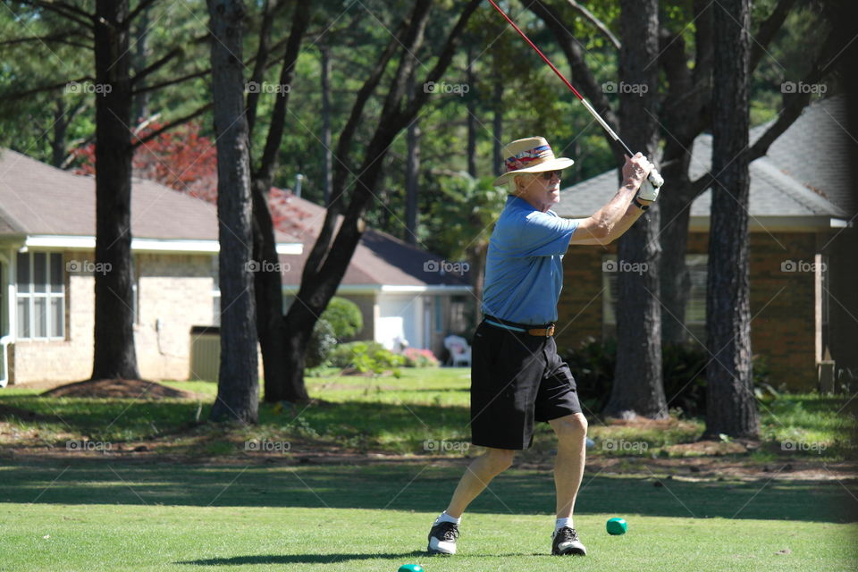 Man playing golf