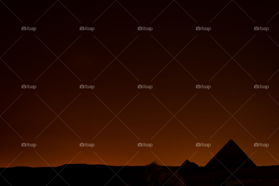 Pyramid on twilight background photo